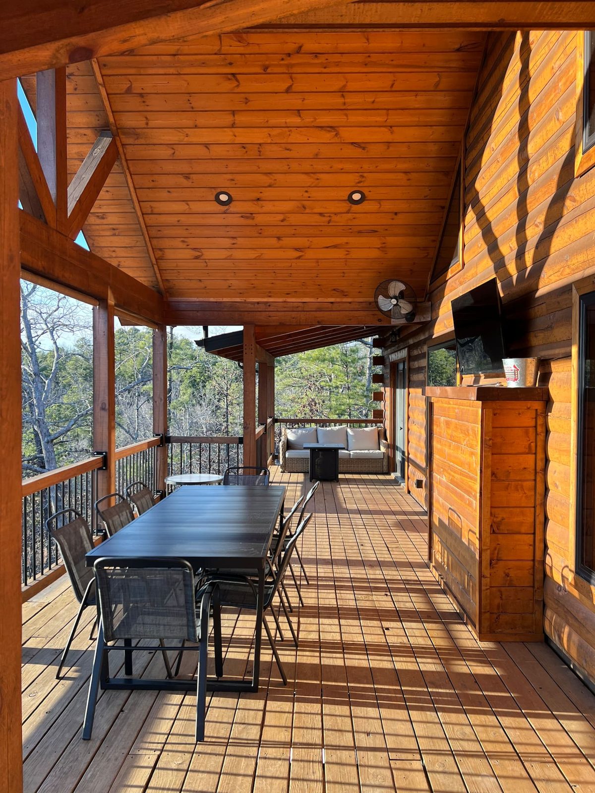 Covered deck dining table with Ozark views